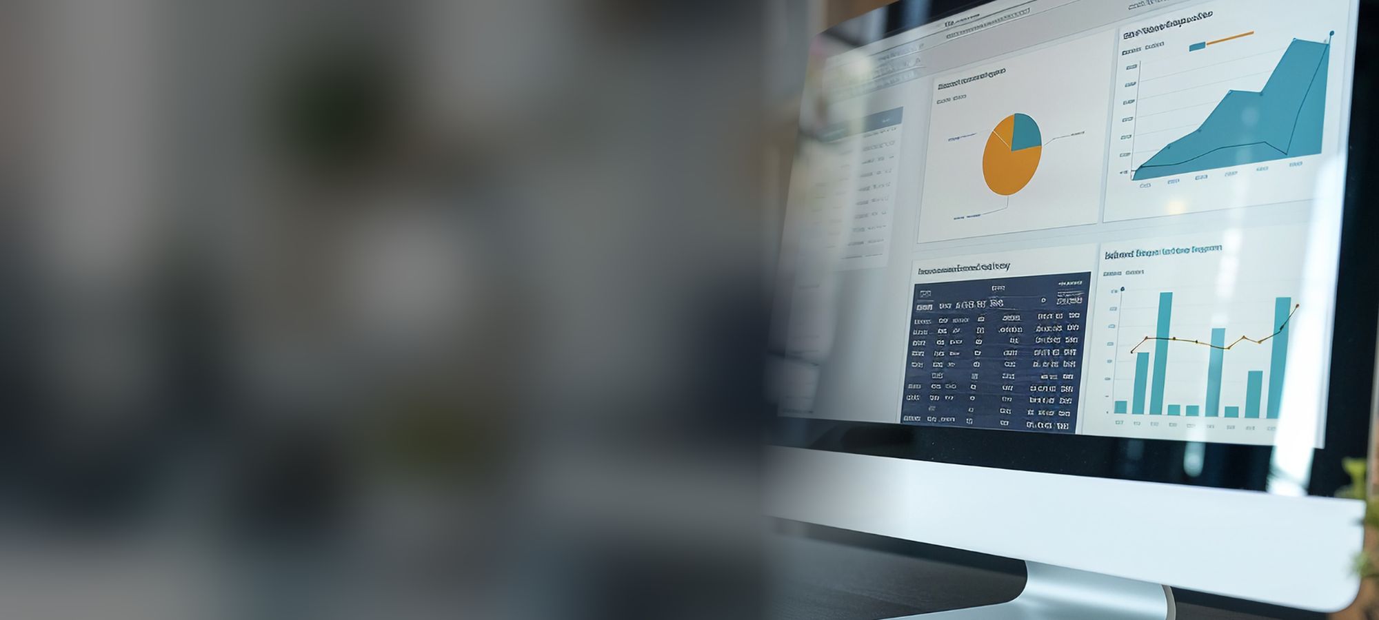 Computer monitor showing CRM data and charts